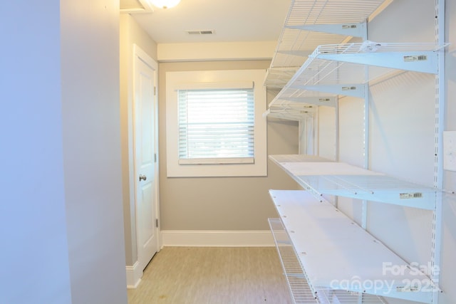 bathroom with hardwood / wood-style floors