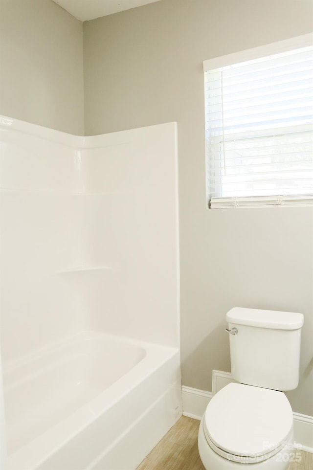 bathroom featuring toilet and wood-type flooring