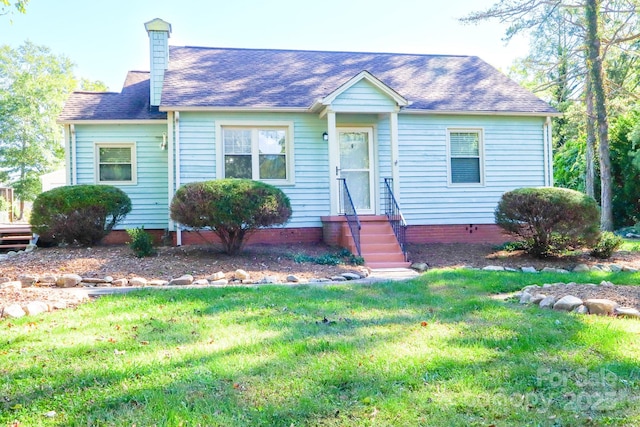 view of front of home with a front yard