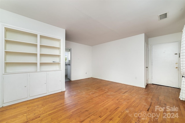 unfurnished living room featuring light wood-type flooring