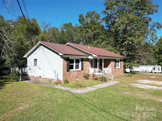 single story home with crawl space, a front lawn, and metal roof