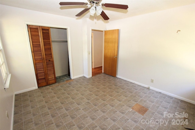 unfurnished bedroom with baseboards, a closet, and a ceiling fan
