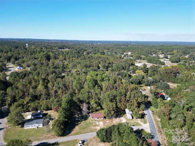 aerial overview of property's location featuring a heavily wooded area