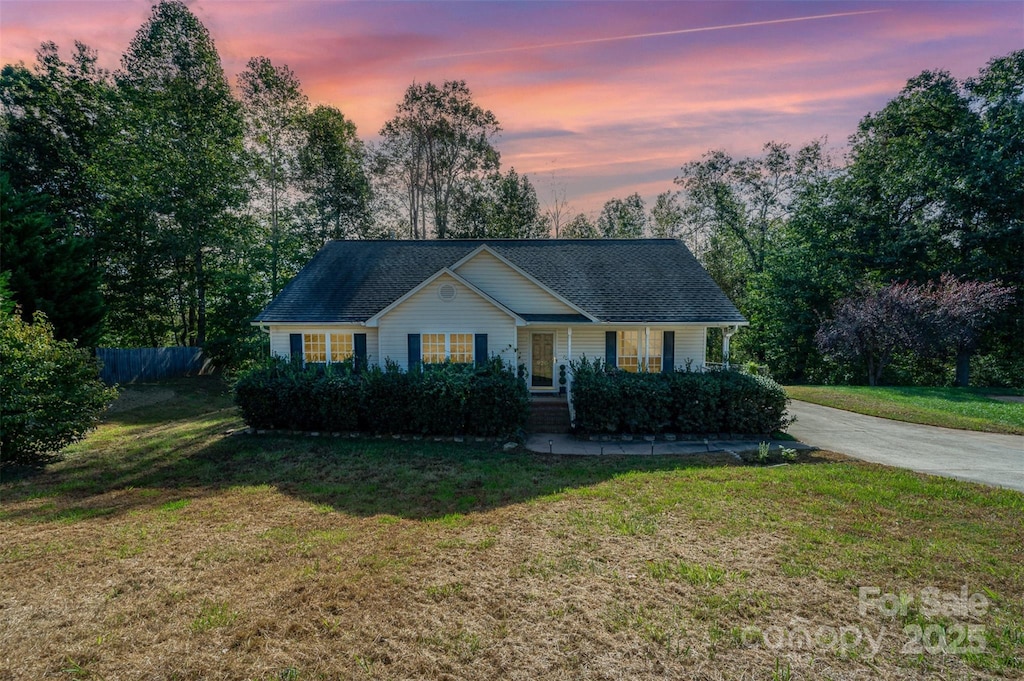 view of front of house with a lawn