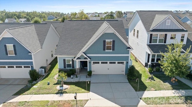 view of front of home with a front yard and a garage