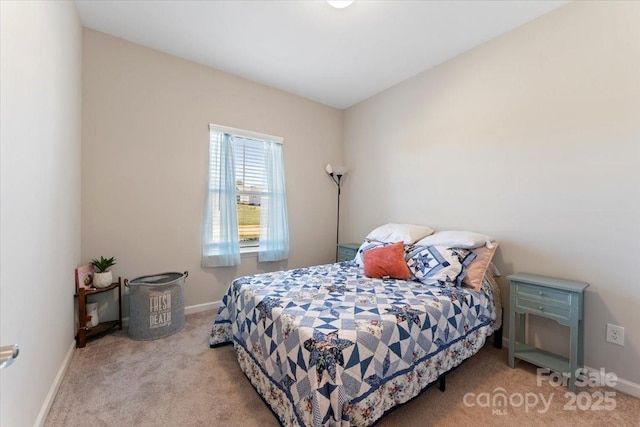 bedroom featuring light colored carpet