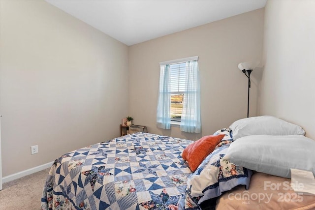 bedroom featuring light colored carpet