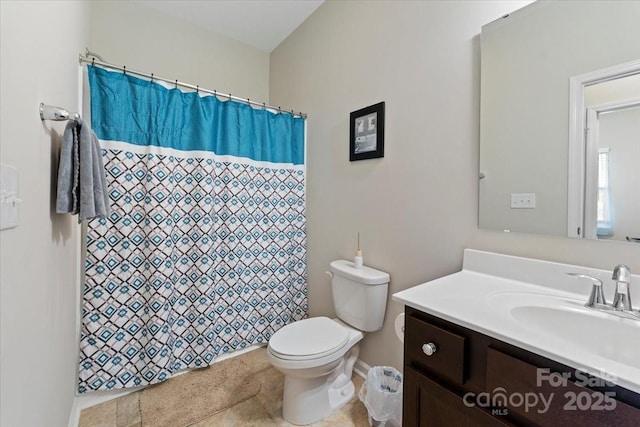 bathroom featuring toilet, vanity, and a shower with shower curtain