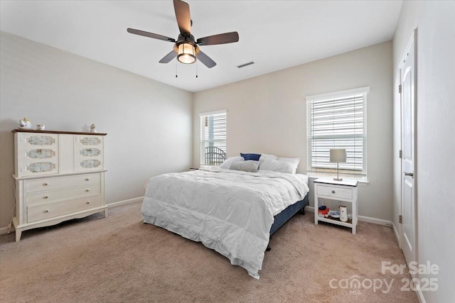 carpeted bedroom with ceiling fan