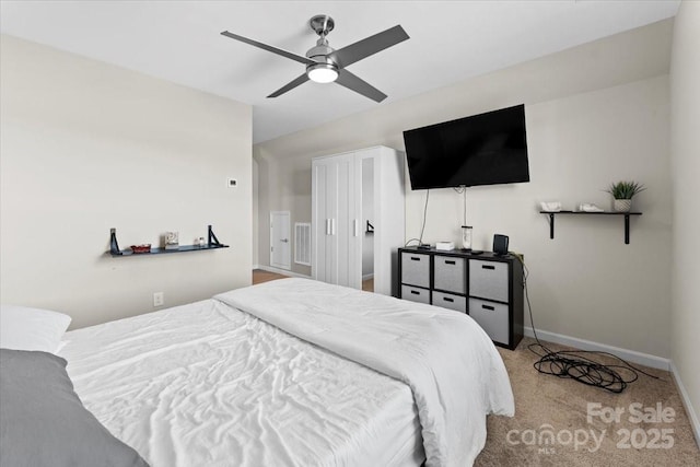 bedroom featuring ceiling fan and light colored carpet