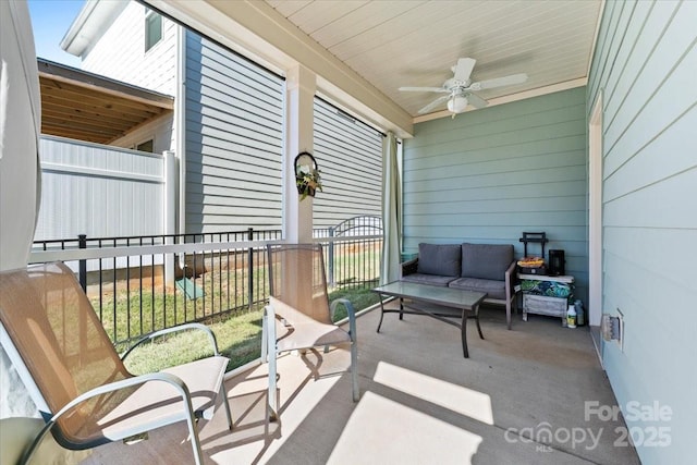 exterior space with ceiling fan and an outdoor living space