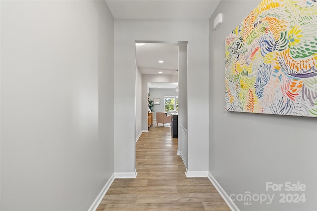 hall with light hardwood / wood-style floors