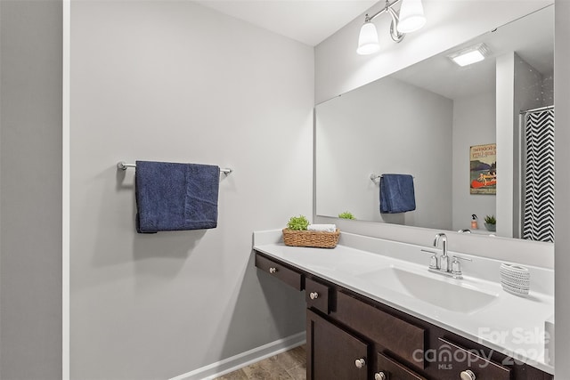 bathroom featuring vanity and hardwood / wood-style floors