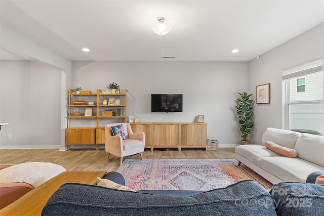 living room with light hardwood / wood-style floors