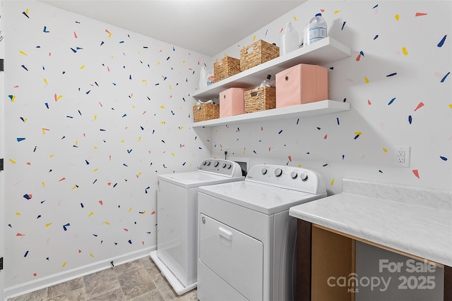 laundry area featuring washing machine and clothes dryer