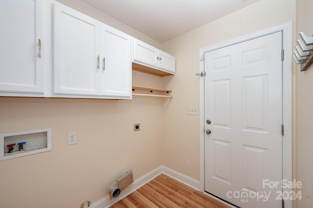 laundry area with washer hookup, cabinets, light wood-type flooring, and electric dryer hookup