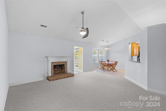 unfurnished living room featuring light carpet, lofted ceiling, a brick fireplace, and ceiling fan