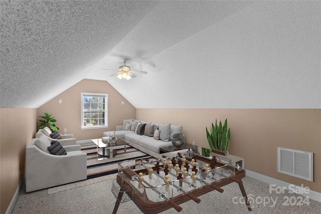 carpeted living room with lofted ceiling, a textured ceiling, and ceiling fan