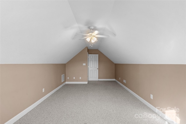 bonus room with vaulted ceiling, carpet floors, and ceiling fan