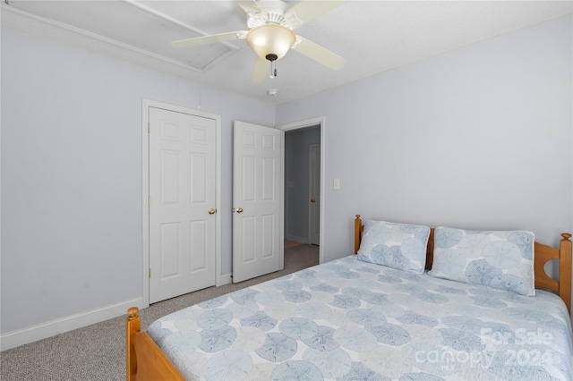 carpeted bedroom with ceiling fan