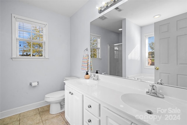 full bathroom featuring vanity, toilet, independent shower and bath, and plenty of natural light