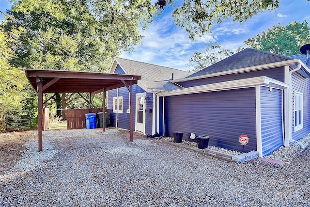 view of front of property featuring a carport