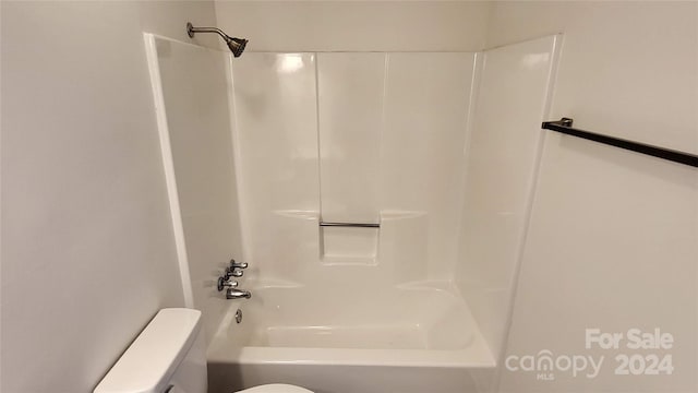 bathroom featuring toilet and shower / washtub combination