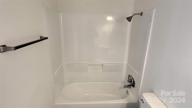 bathroom with shower / tub combination and toilet