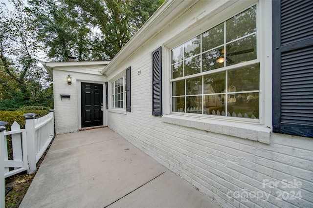 view of side of property featuring a patio