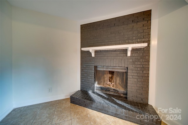 details featuring a fireplace and tile patterned floors