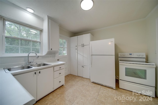 kitchen featuring white appliances, sink, ornamental molding, white cabinets, and a textured ceiling