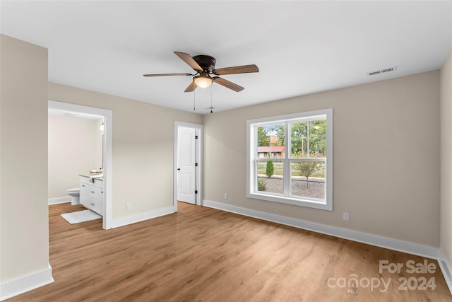 spare room with light hardwood / wood-style flooring and ceiling fan