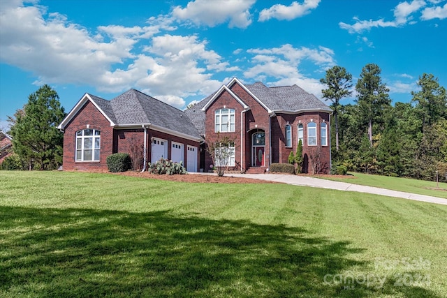 front of property featuring a garage and a front lawn