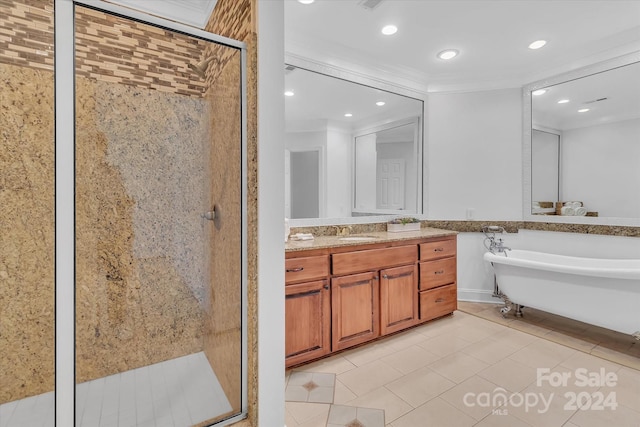 bathroom featuring ornamental molding, tile patterned floors, vanity, and independent shower and bath