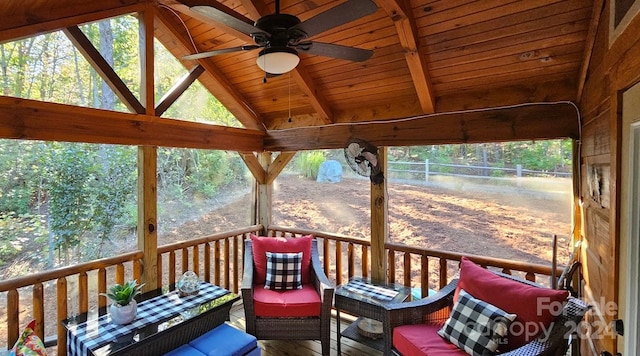 wooden terrace with a gazebo and ceiling fan