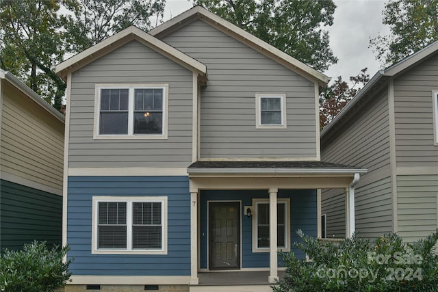 view of property with a porch