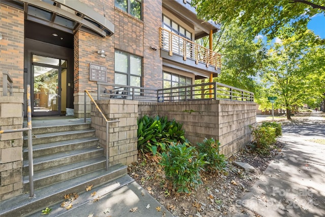 doorway to property featuring a balcony