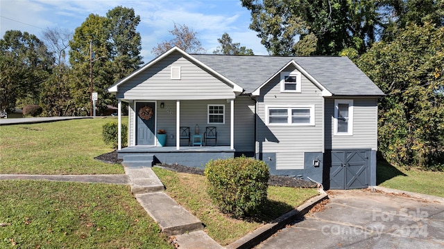 bungalow-style home featuring a porch and a front lawn