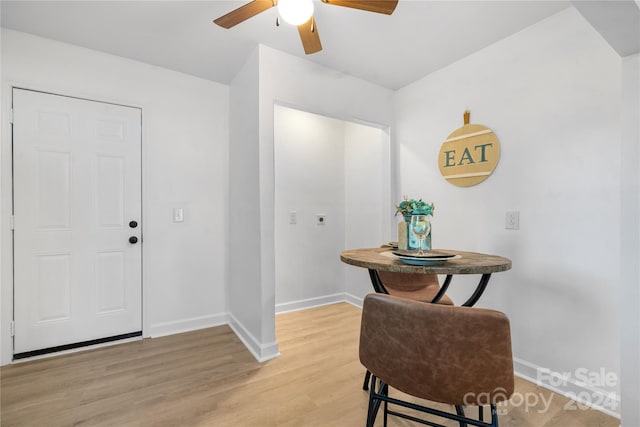 foyer with ceiling fan and light wood-type flooring