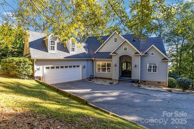 front facade featuring a garage and a front yard