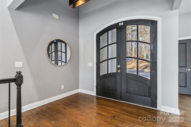 entrance foyer with french doors and dark wood-type flooring