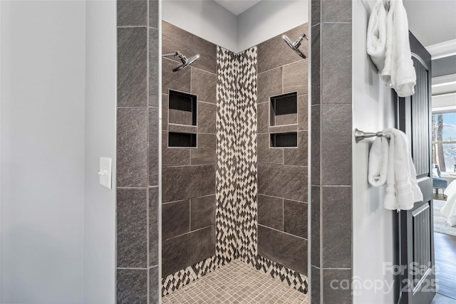 bathroom with a tile shower