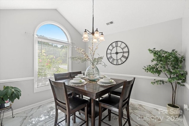 dining space with an inviting chandelier, lofted ceiling, and a textured ceiling