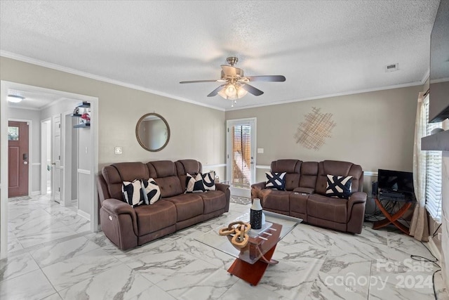 living room featuring ceiling fan, a textured ceiling, and crown molding