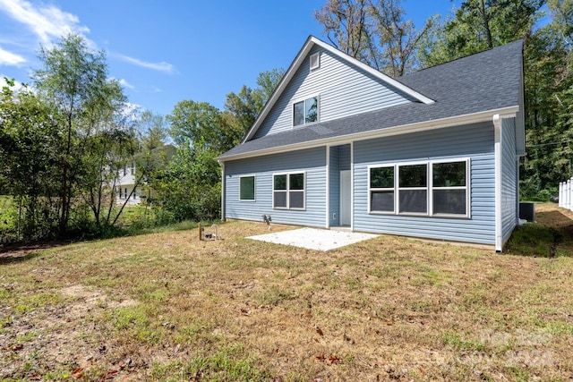 back of house with a yard and a patio area