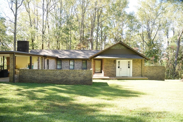 ranch-style home with a front lawn