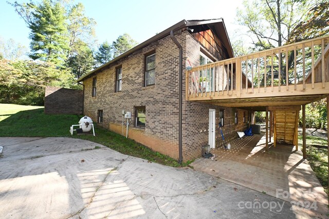 view of home's exterior with cooling unit and a deck