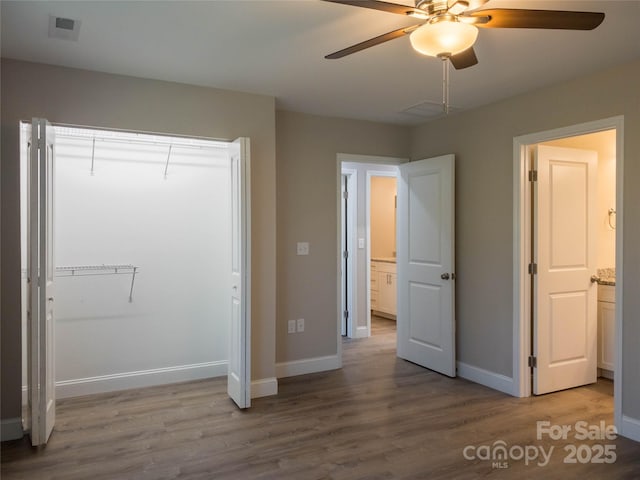 unfurnished bedroom with ceiling fan and light hardwood / wood-style floors