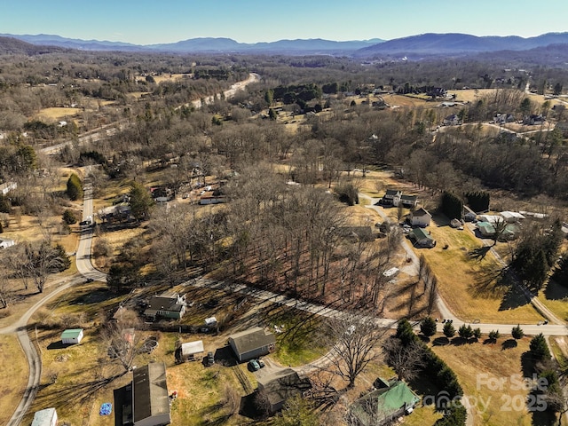 drone / aerial view featuring a mountain view