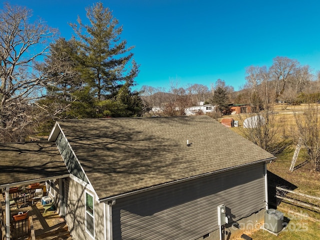 view of side of home featuring cooling unit